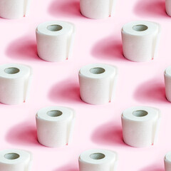 White toilet paper roll repeat seamless pattern on light pink background.
