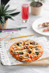 Small pizza for kids over white table