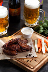 Fried chicken wings with glass of beer