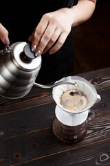 making filtered coffee on wooden table