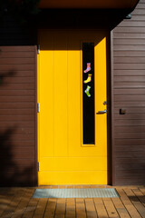 Paper socks of different colors hang on the door. World Down Syndrome Day.