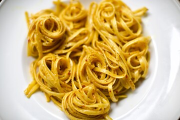 curry spicy and creamy al dente spaghetti on white porcelain plate