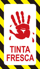 A sign that warns in Portugueese language : wet paint. 