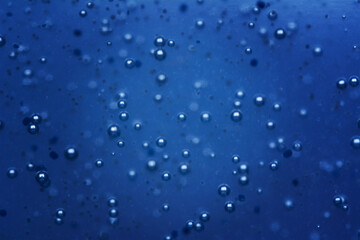 Abstract Blue water bubbles background or texture. Shallow depth of field image.
