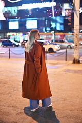 woman walking in the city at night 