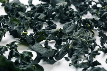 Dehydrated Sea mustard on white background，Undaria pinnatifida Suringar © Jianyi Liu 
