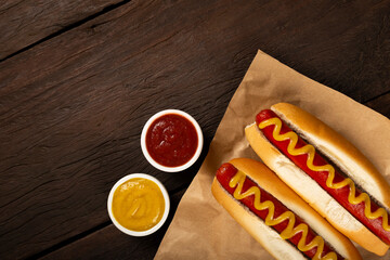 Hot dog with ketchup and yellow mustard.