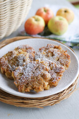Apple fritters for breakfast. Delicious and hearty pancakes.