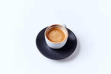 Cup of coffee on bright wooden background. Copy space.	