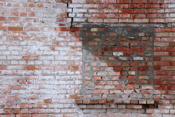 Blocked up a window in a red and white brick wall. Bricked up window. Old brick wall background. 	
