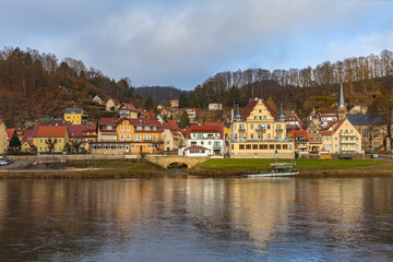 Fototapeta premium Panorama view of Stadt Wehlen on the Elbe river side near Saxon Switzerland National Park, on a sunny winter day in Saxony, Germany