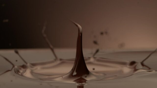 Super Slow Motion Detail Shot of Melted Chocolate Crown Splash at 1000 fps.