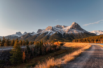 Scenery of Sunrise on Mount Rundle, Ha-Ling, Lady Macdonals with blue sky in autumn forest at...