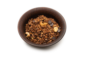 Chocolate granola cereal with nuts in a bowl background.