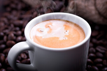 cup of coffee with beans