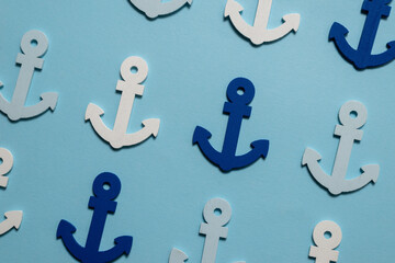 Blue anchors on a blue background.