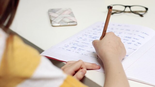 Young girl doing homework at home