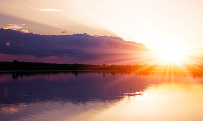Fototapeta na wymiar scenic evening red sunset on the lake