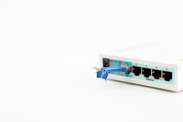 Wi-Fi router with cut cable. White router with dangling cord. On white background router with...