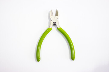 Side cutters on white background. Green side cutters open, sharp. Side cutting device. Side cutter.