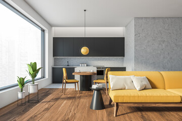 Living room interior with yellow sofa and eating room