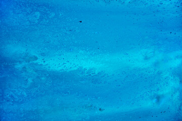 Obraz na płótnie Canvas A blue texture reminiscent of water or ocean. Watercolor paints
