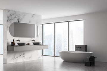 Fototapeta na wymiar Corner of modern bathroom with double sink and white bathtub, large panoramic window, city view, minimalistic marble and concrete interior design.