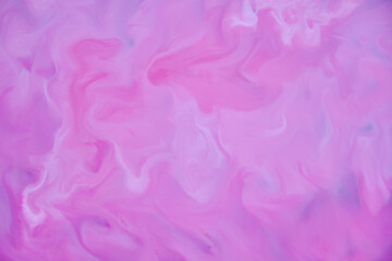Fototapeta premium Watercolor pink and white paints. Mixing colors on a surface similar to waves