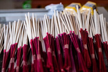 Incense and candles are used as offerings.