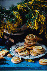 biscuits with lemon with a bouquet of mimosa.style vintage