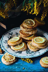 biscuits with lemon with a bouquet of mimosa.style vintage