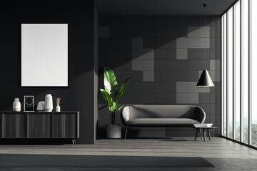 Dark living room interior with sofa and poster