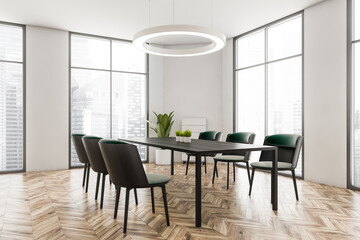 Light wooden dining room interior with furniture near window
