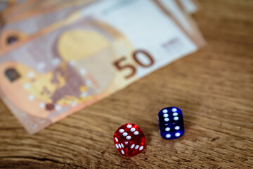 several colored dice and euro money