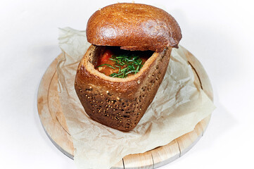 Hodgepodge soup served in a bread bowl
