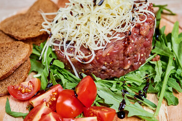 Beef cutlet with salad, cheese and bread