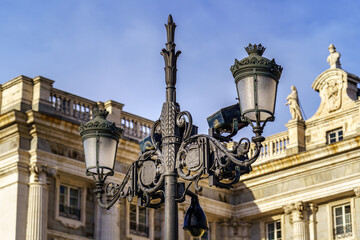 Detail of old lamppost of the royal palace of Madrid.
