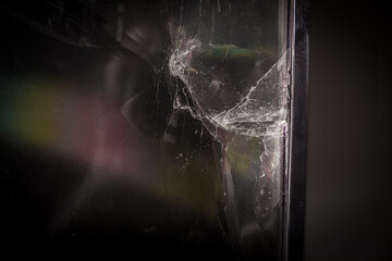 Broken led screen hit by a hammer. The concept of hatred of television.