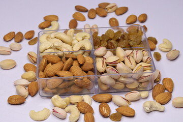 Fototapeta na wymiar Silver Tray with mixed dried fruits on white Background