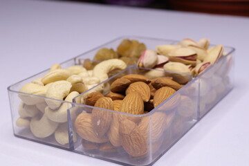 Silver Tray with mixed dried fruits on white Background