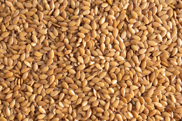 macro golden flax seeds background
