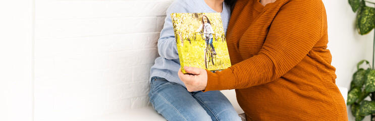 little girl and grandmotherg with banner in hands, a photo canvas