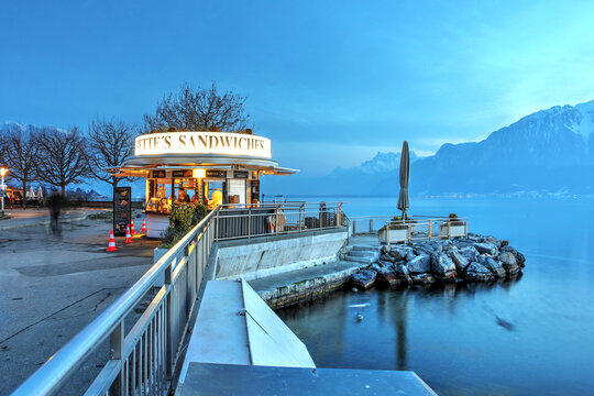 Waterfront promenade by the lake in Vevey, Switzerland with an art-deco boutique serving sweet snacks to visitors - Babette's Sandwiches.