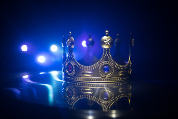 low key image of beautiful queen/king crown over wooden table. vintage filtered. fantasy medieval...