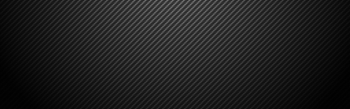 Carbon background wide. Realistic fiber texture. Dark futuristic backdrop with shadow. Metal cells design. Black composite material. Modern technology wallpaper. Vector illustration