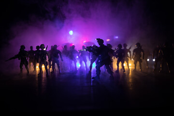 Anti-riot police give signal to be ready. Government power concept. Police in action. Smoke on a...