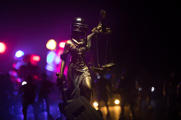 Obraz premium Law concept. Miniature colorful artwork decoration with fog and backlight. The Statue of Justice - lady justice or Iustitia Justitia the Roman goddess of Justice. Selective focus