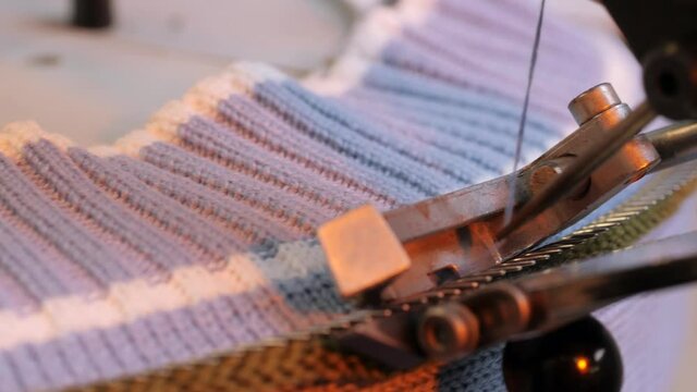 Production of knitted garments. Fabric factory. Clothes Making. Automated industrial Textile Sewing machine.