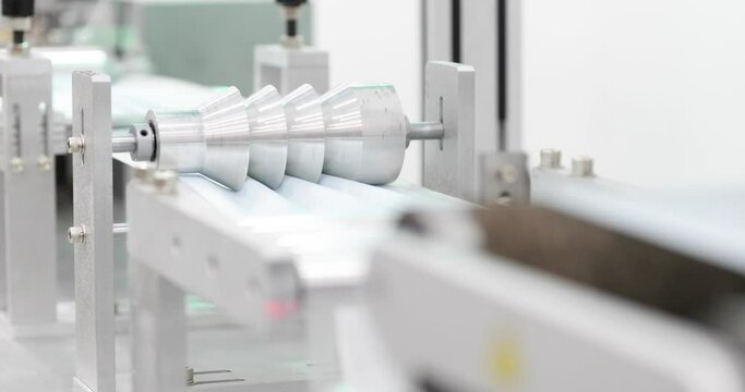Folding Wheel For Mask Making Machine At Production Line. - panning right