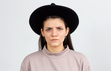 Waist-up portrait of beautiful girl frowning her face in displeasure. Attractive young woman in...